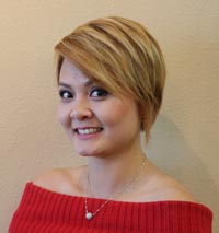 Smiling young woman with blond streaked short hair style